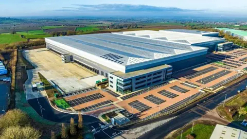 Large logistics warehouse with yard and docks